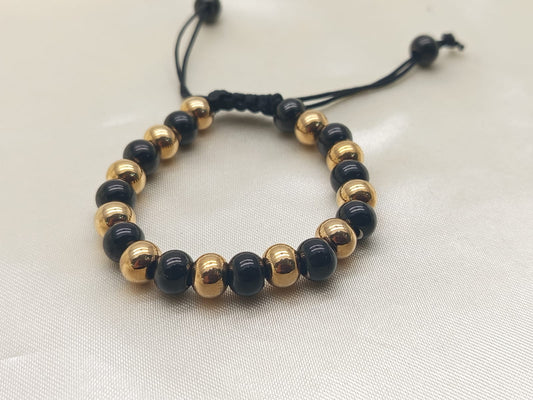 PULSERA PIEDRA NATURAL NEGRA Y DORADO
